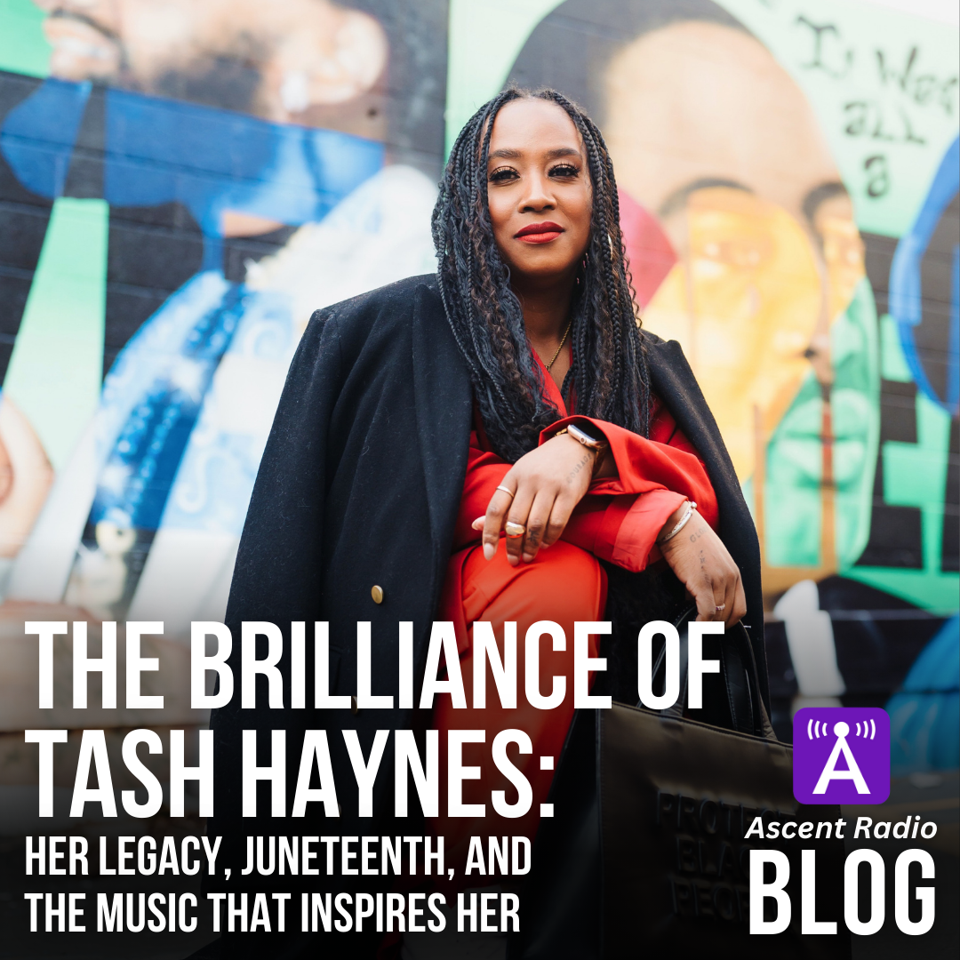 Tash Haynes kneeling by a mural